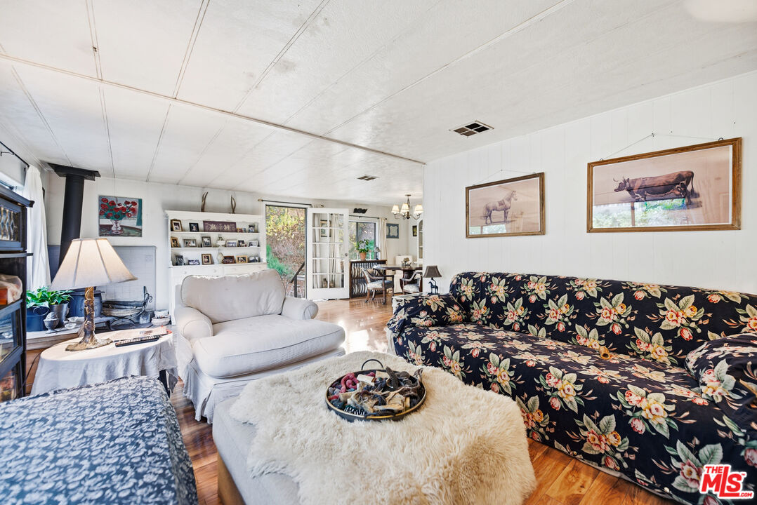 1667 Las Virgenes Canyon Road, Unit 5 Calabasas, CA 91302 - Photo 16 of 36 a living room with furniture and a table