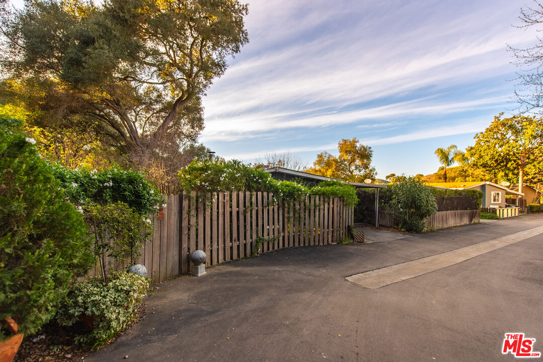 1667 Las Virgenes Canyon Road, Unit 5 Calabasas, CA 91302 - Photo 28 of 36 a view of a terrace with a garden