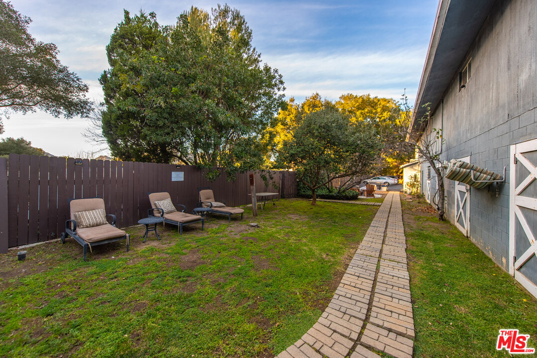 1667 Las Virgenes Canyon Road, Unit 5 Calabasas, CA 91302 - Photo 30 of 36 a view of a backyard with sitting area
