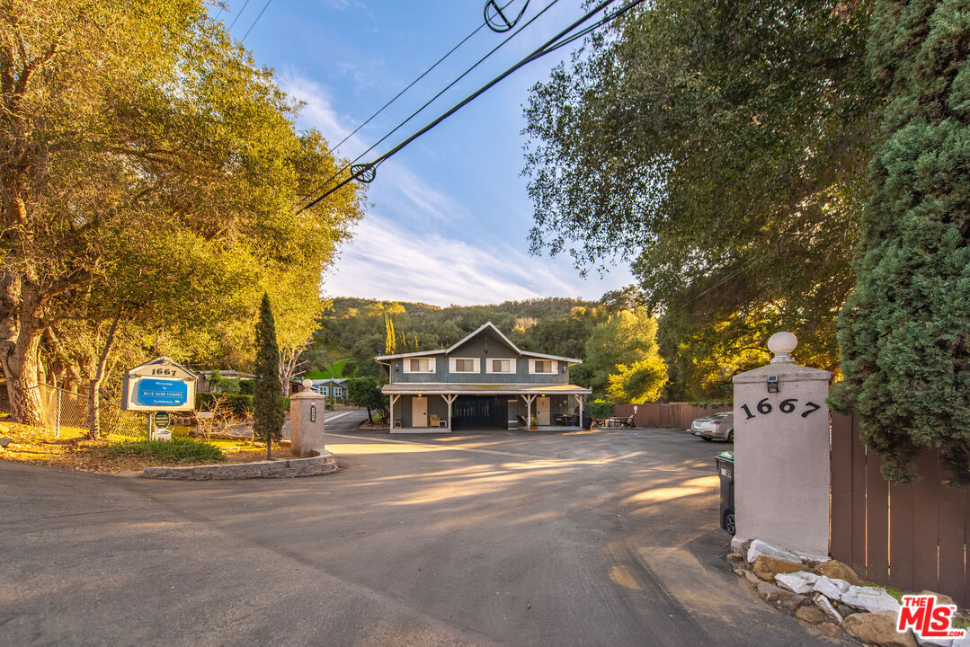 1667 Las Virgenes Canyon Road, Unit 5 Calabasas, CA 91302 - Photo 34 of 36 a sign on the side of a building