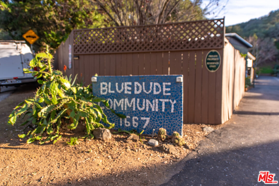 1667 Las Virgenes Canyon Road, Unit 5 Calabasas, CA 91302 - Photo 36 of 36 a sign that is on the side of the road