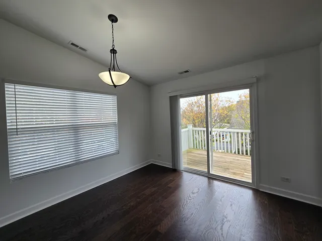 a bathroom with a double vanity sink a toilet and a mirror