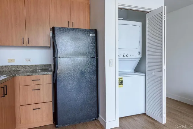 a kitchen with a refrigerator and cabinets