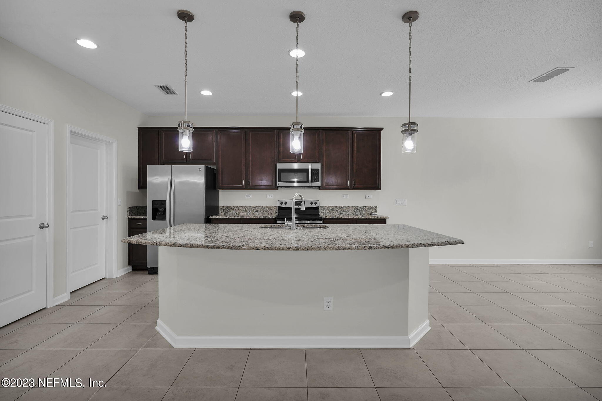 3513 Butternut Way Orange Park, FL 32065 - Photo 11 of 38 a view of kitchen with stainless steel appliances granite countertop a sink a refrigerator and a stove