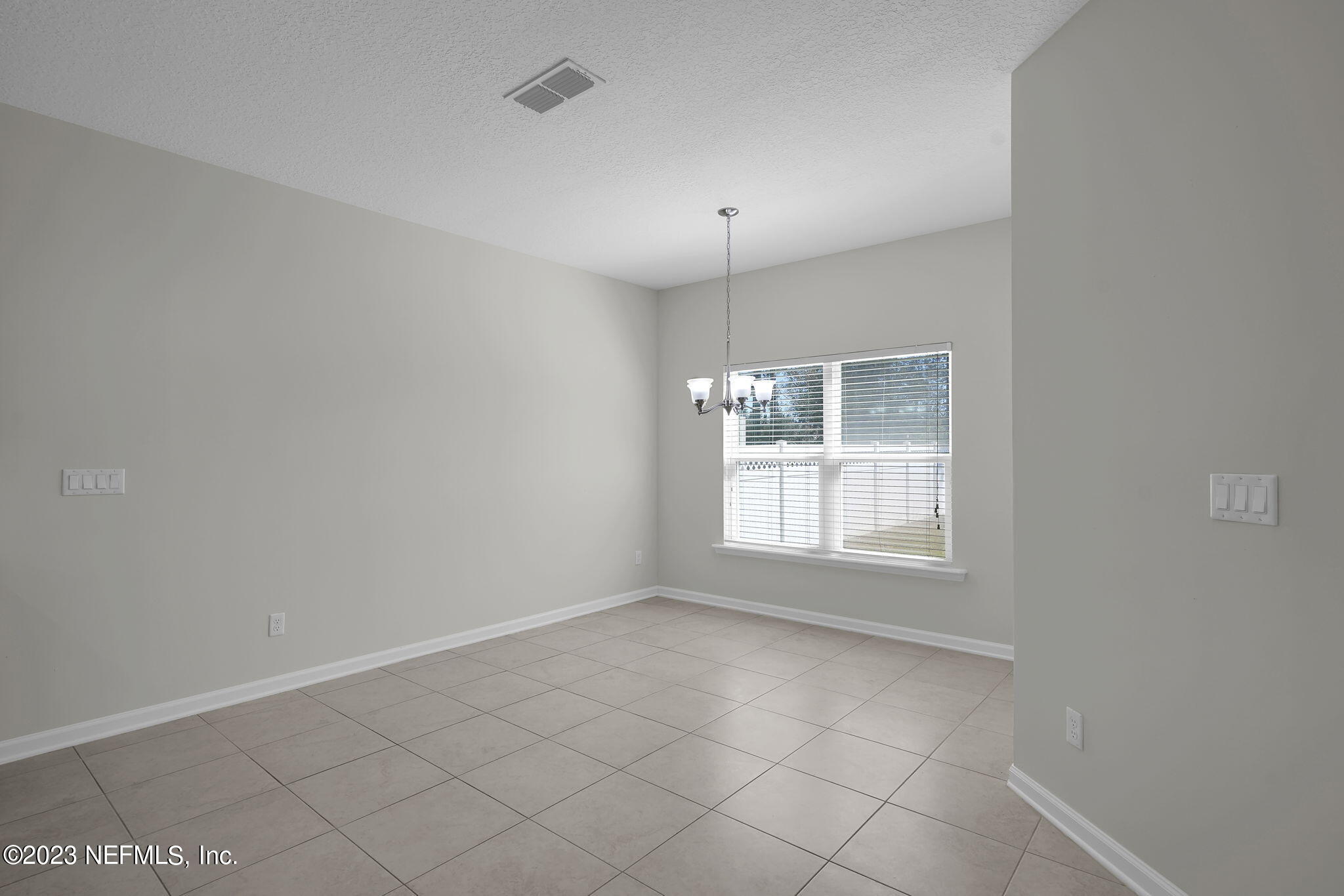 3513 Butternut Way Orange Park, FL 32065 - Photo 14 of 38 an empty room with windows
