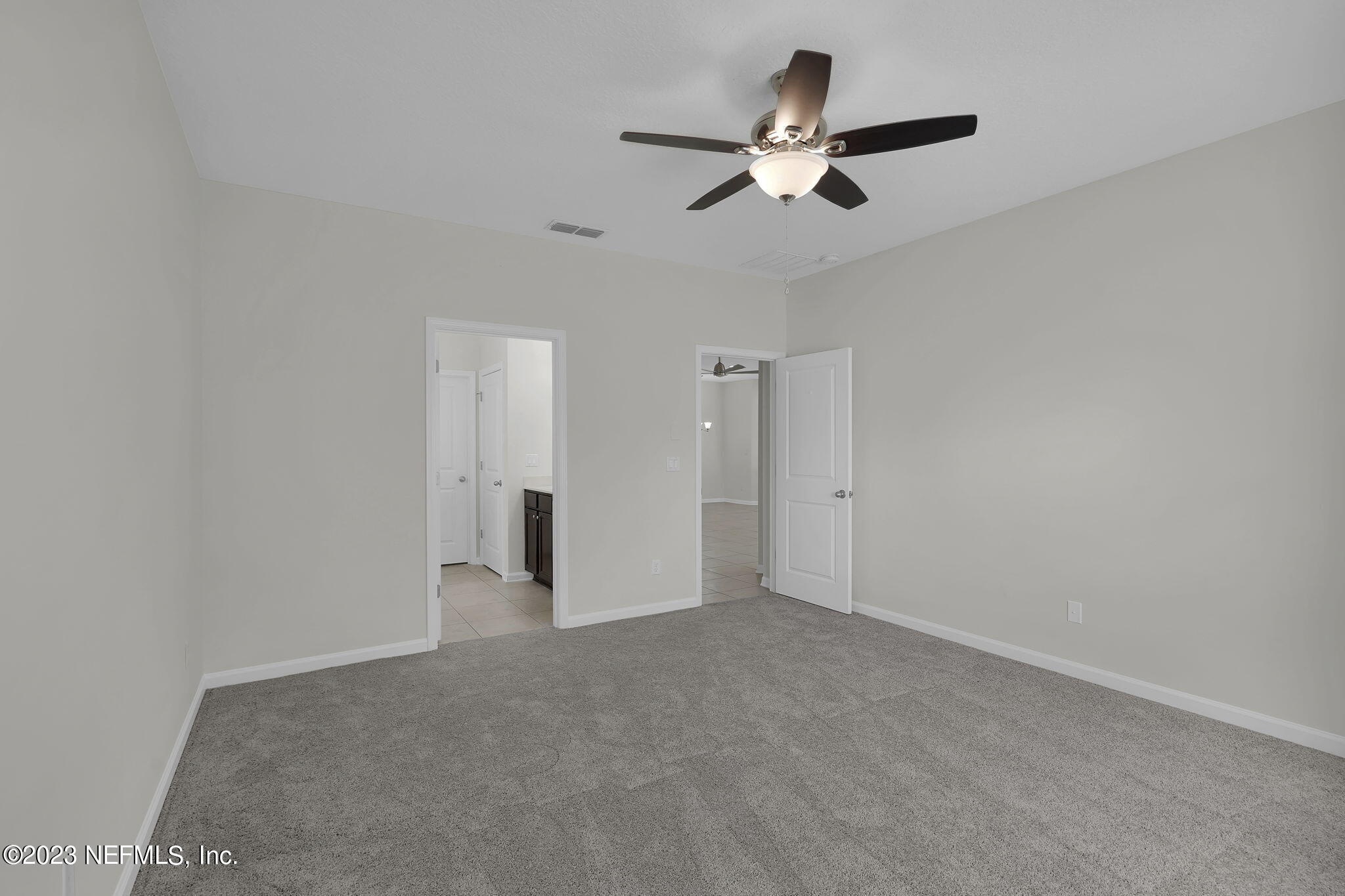 3513 Butternut Way Orange Park, FL 32065 - Photo 18 of 38 a view of an empty room with a ceiling fan