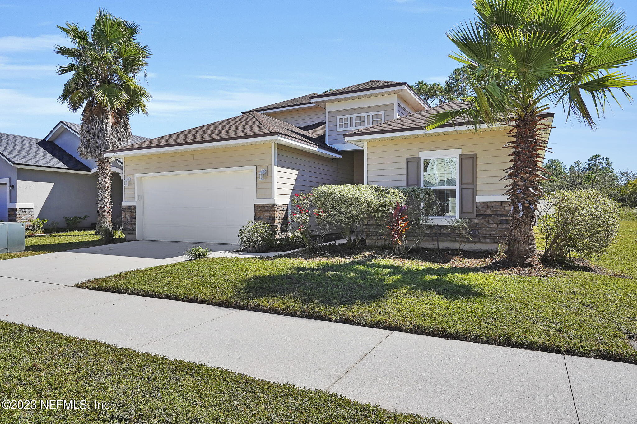 3513 Butternut Way Orange Park, FL 32065 - Photo 2 of 38 a front view of a house with a garden and plants