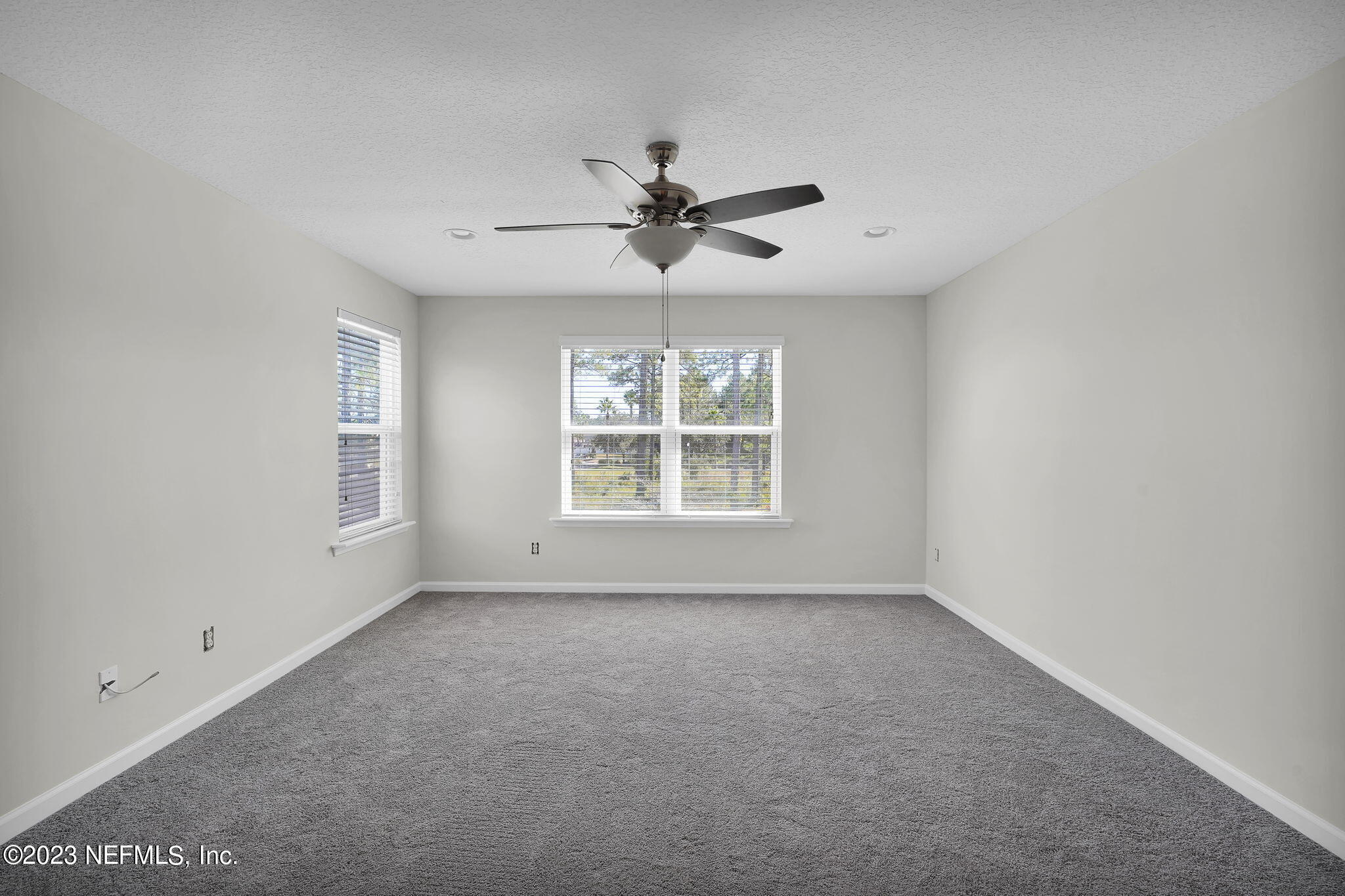 3513 Butternut Way Orange Park, FL 32065 - Photo 31 of 38 an empty room with a window and a ceiling fan