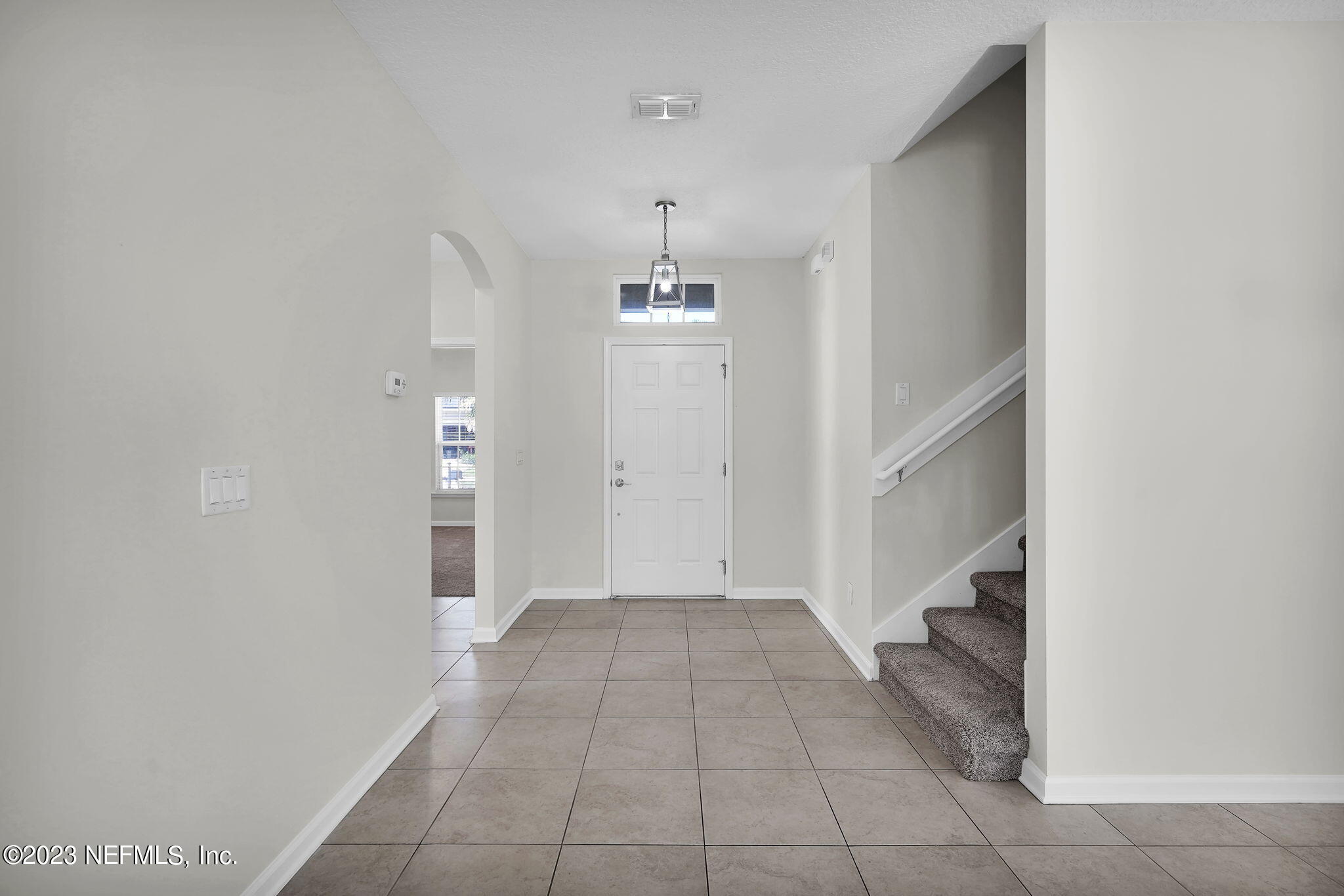 3513 Butternut Way Orange Park, FL 32065 - Photo 5 of 38 a view of a hallway view with chandelier