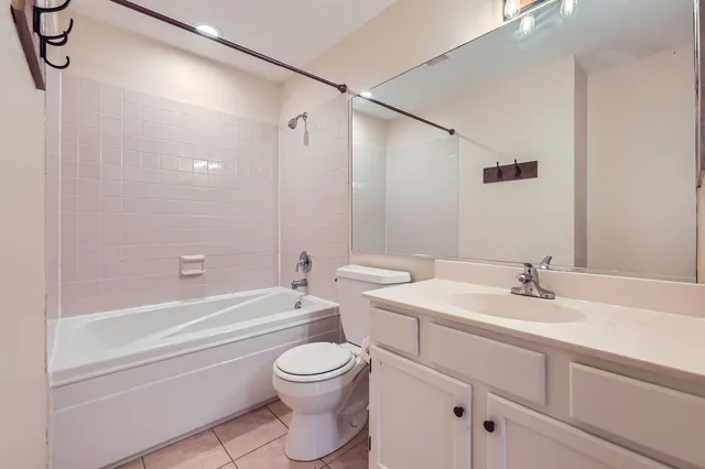 a bathroom with a sink a toilet and a bathtub