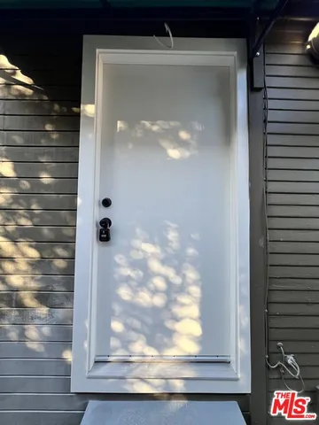 a room with a stove and a refrigerator