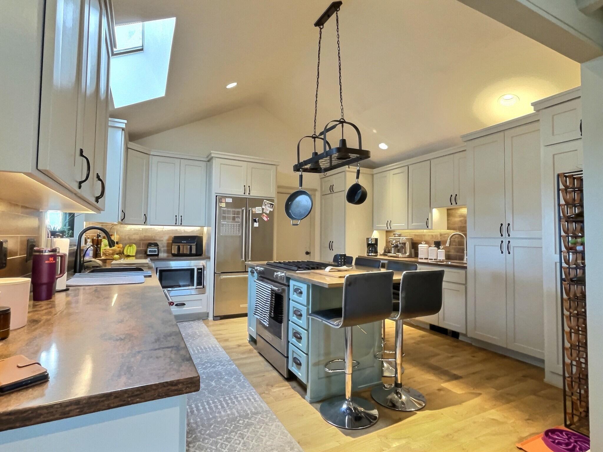 60360 Horse Butte Road Bend, OR 97702 - Photo 16 of 58 a large kitchen with a table and chairs in it