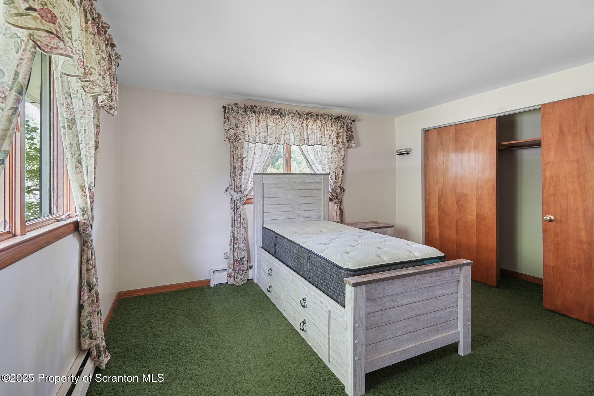 17512 Highway 267 Montrose, PA 18801 - Photo 23 of 27 a room with a bed and a window