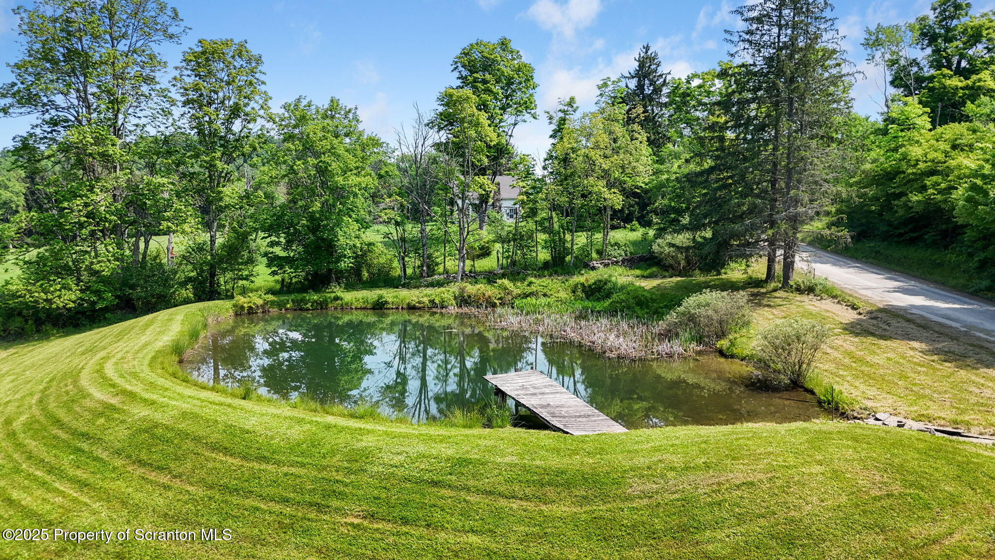 17512 Highway 267 Montrose, PA 18801 - Photo 7 of 27 a view of a garden with a fountain