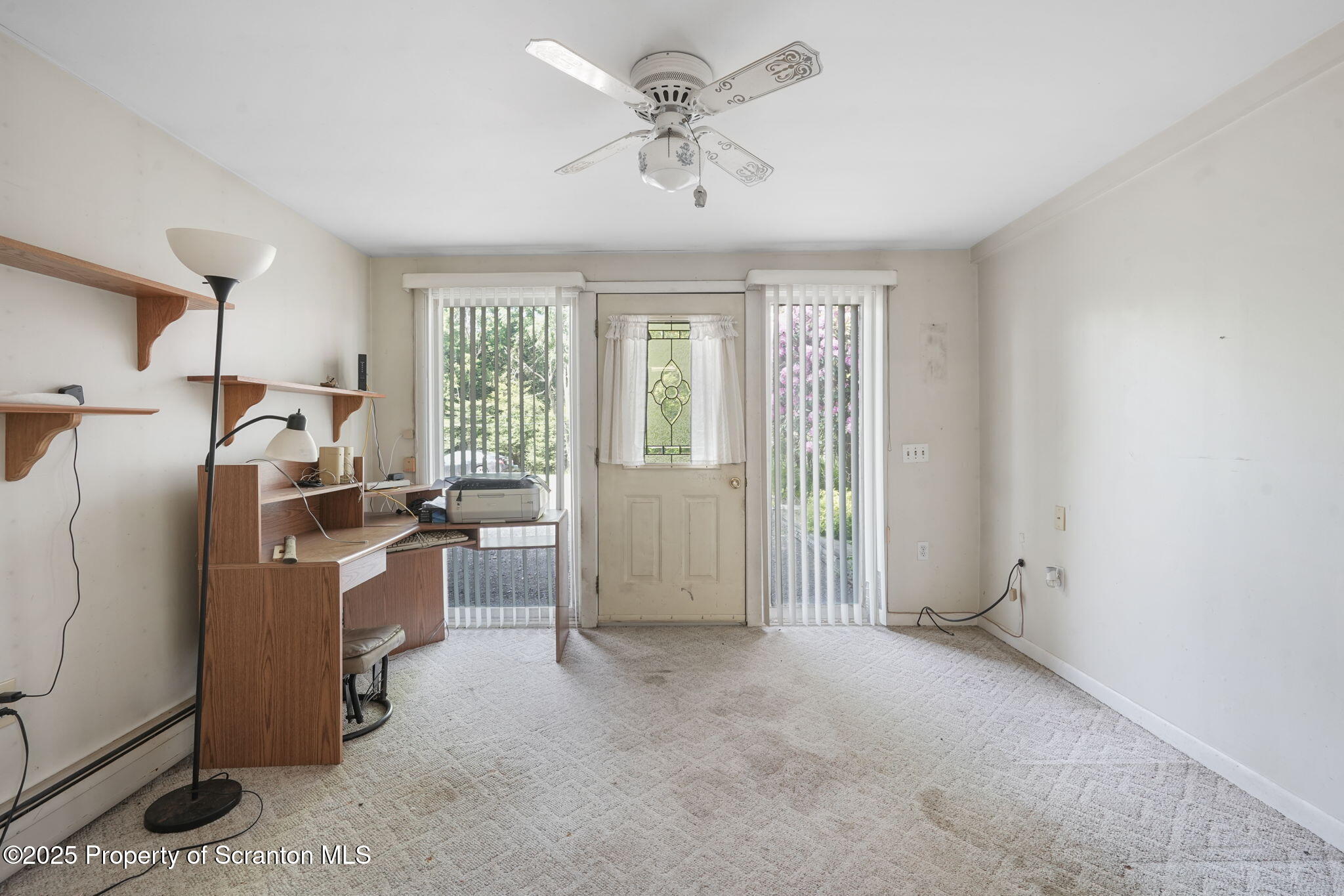 17512 Highway 267 Montrose, PA 18801 - Photo 8 of 27 a view of a kitchen with refrigerator cabinets and a ceiling fan