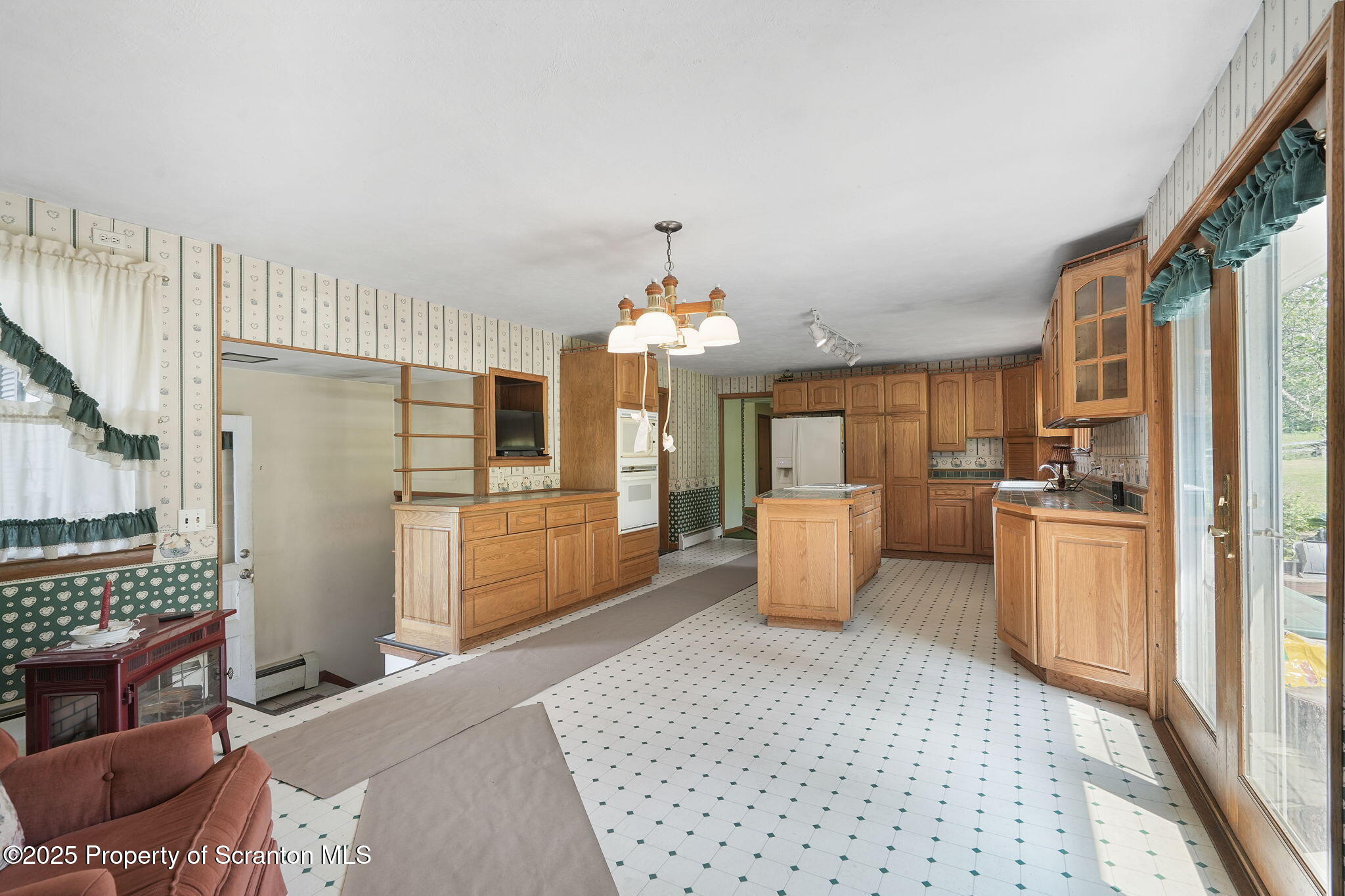 17512 Highway 267 Montrose, PA 18801 - Photo 9 of 27 a kitchen with stainless steel appliances kitchen island granite countertop a refrigerator and a sink