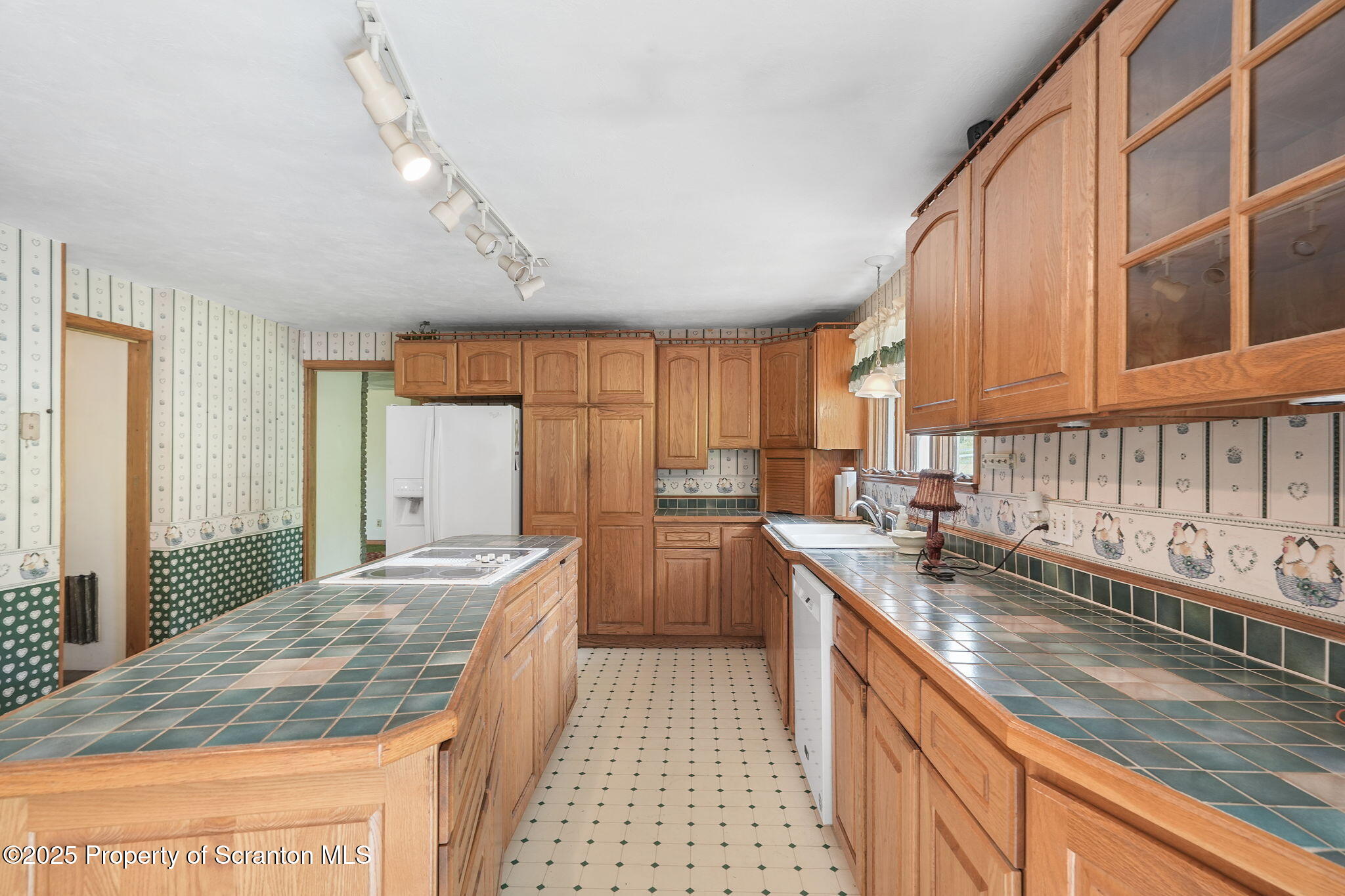 17512 Highway 267 Montrose, PA 18801 - Photo 10 of 27 a kitchen with sink a stove and cabinets