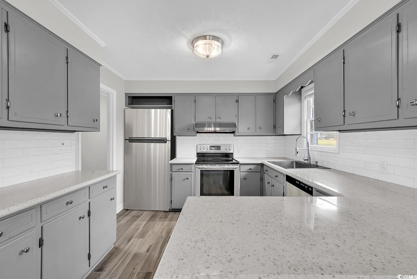 4320 Stevens Street Loris, SC 29569 - Photo 12 of 33 Kitchen featuring gray cabinetry, light wood-style