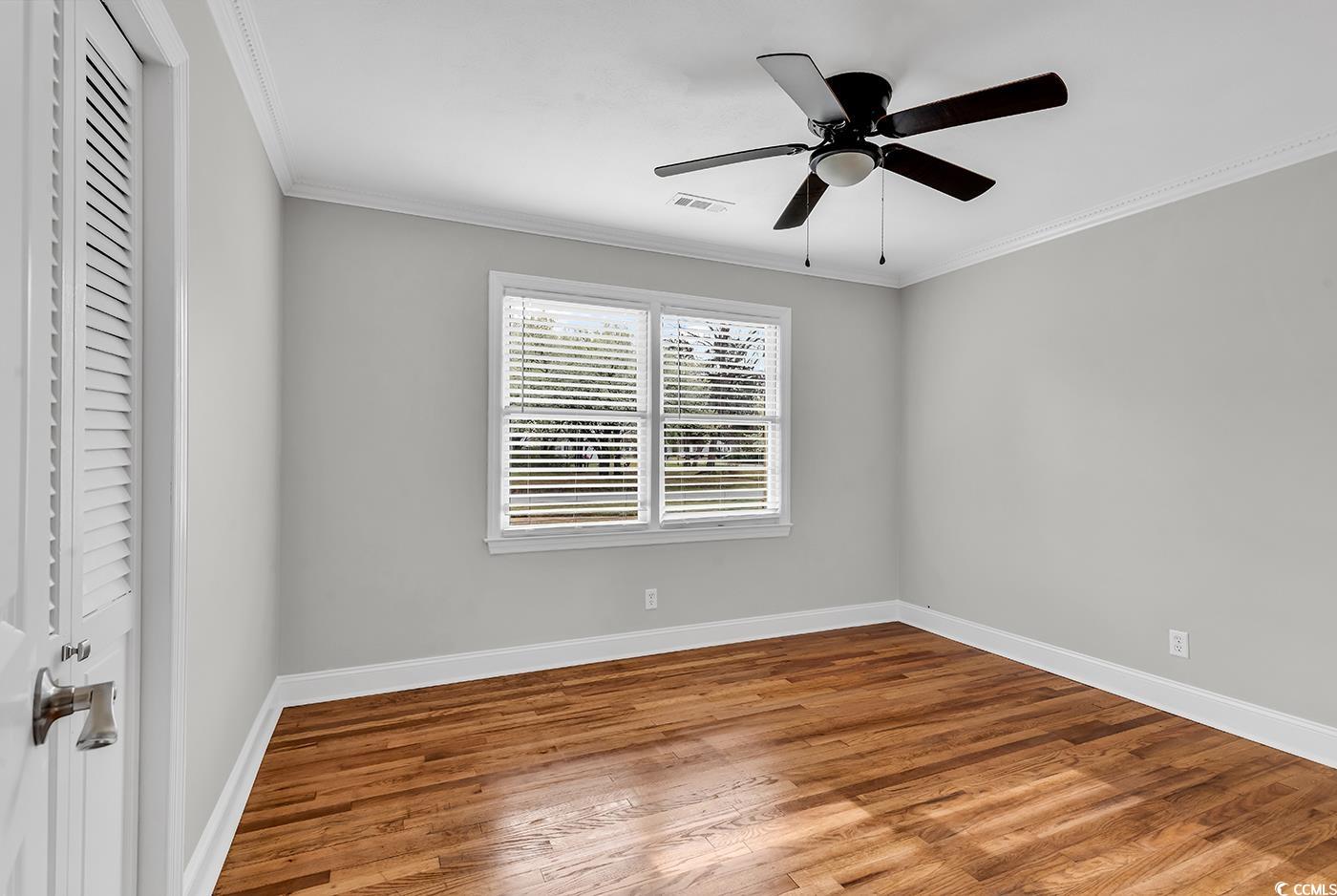 4320 Stevens Street Loris, SC 29569 - Photo 15 of 33 Unfurnished bedroom with wood finished floors, bas