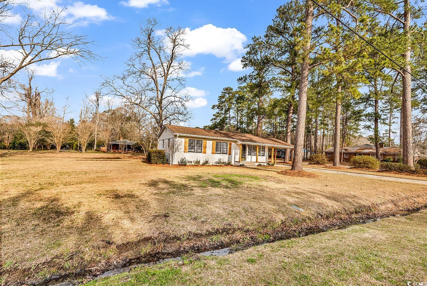 4320 Stevens Street Loris, SC 29569 - Photo 2 of 33 View of front of home with covered porch and a fro