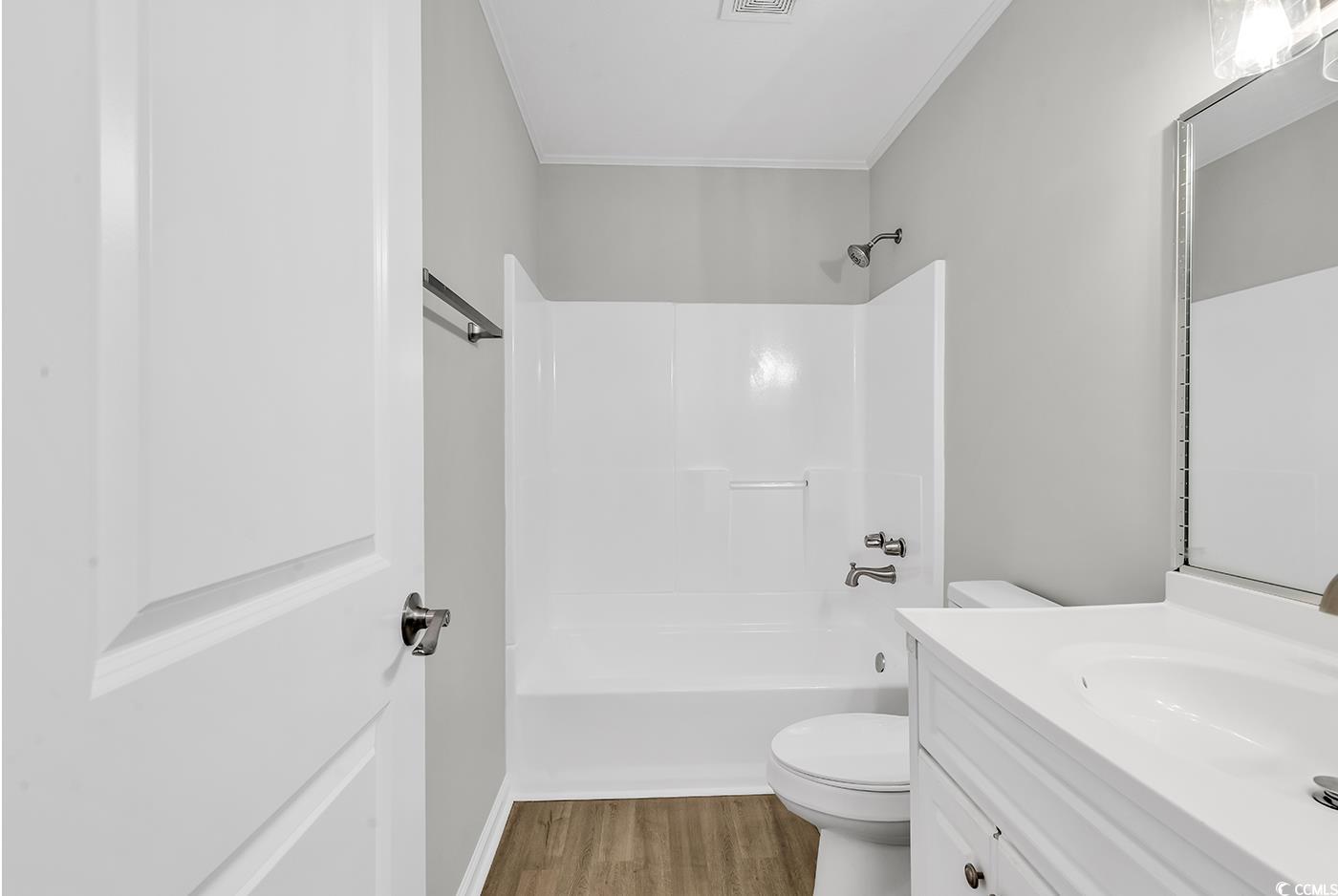 4320 Stevens Street Loris, SC 29569 - Photo 22 of 33 Bathroom with visible vents, toilet, wood finished