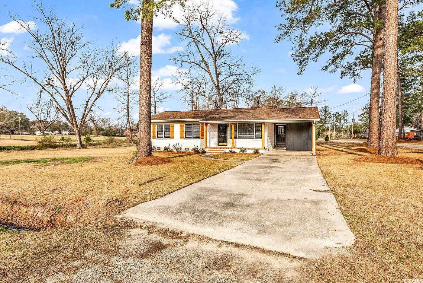 4320 Stevens Street Loris, SC 29569 - Photo 25 of 33 View of front of property featuring a carport, a f