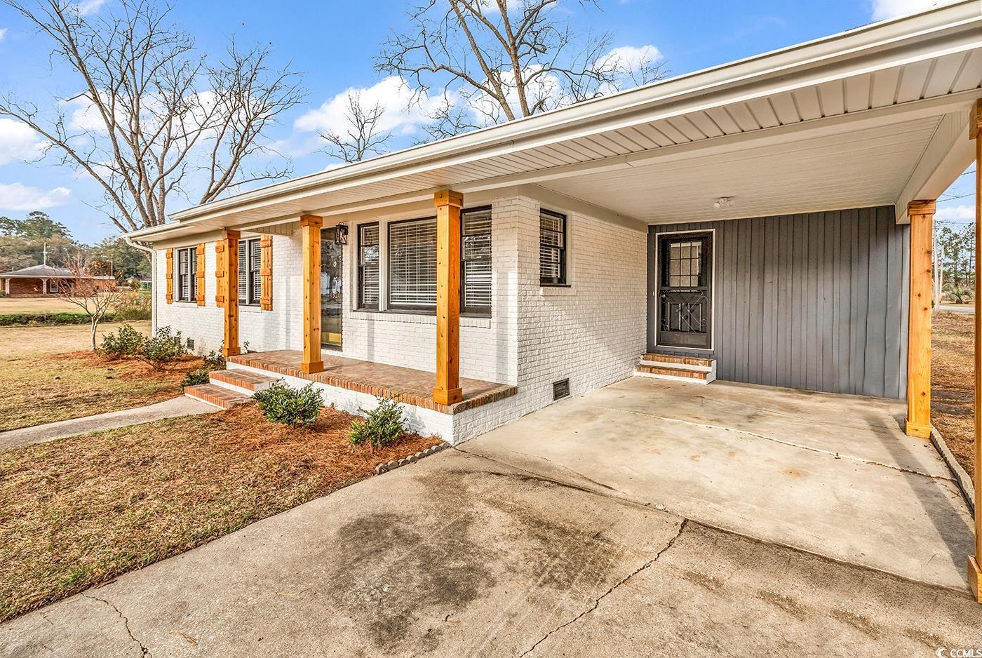 4320 Stevens Street Loris, SC 29569 - Photo 3 of 33 Exterior space featuring an attached carport, driv