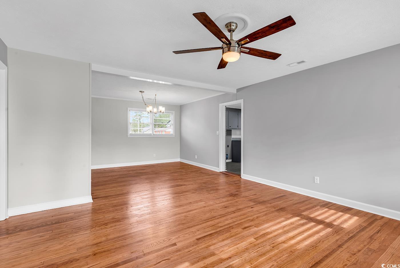 4320 Stevens Street Loris, SC 29569 - Photo 5 of 33 Spare room featuring visible vents, ceiling fan wi
