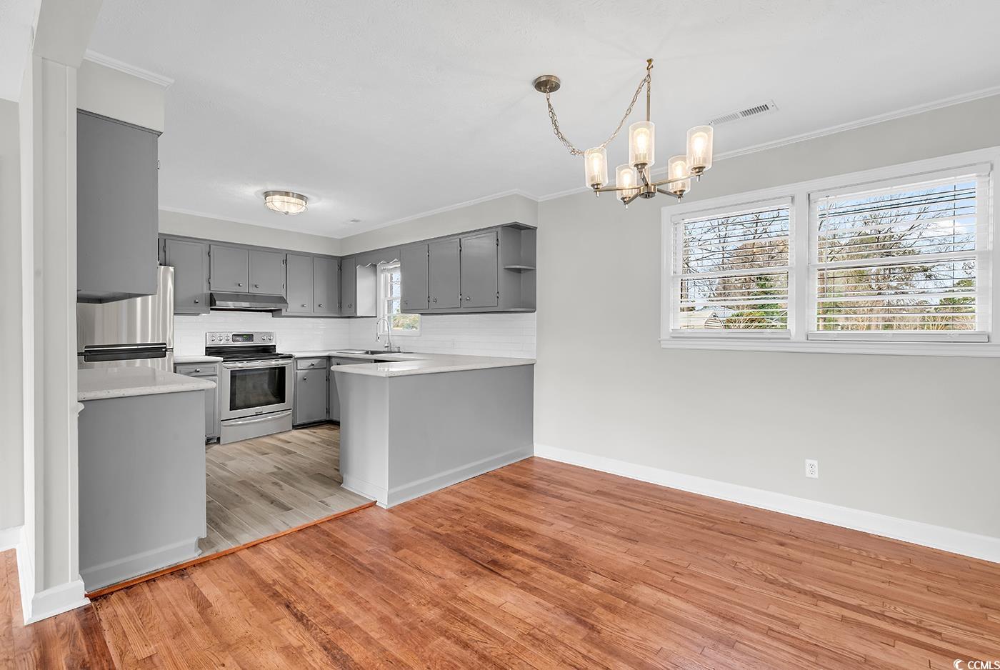 4320 Stevens Street Loris, SC 29569 - Photo 8 of 33 Kitchen with visible vents, gray cabinets, backspl