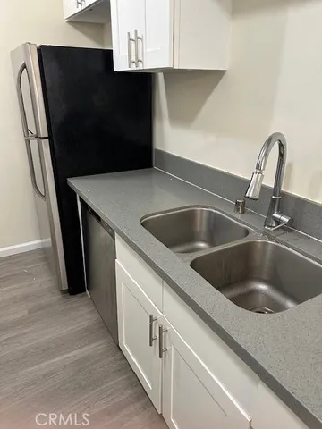 a stove top oven sitting inside of a kitchen