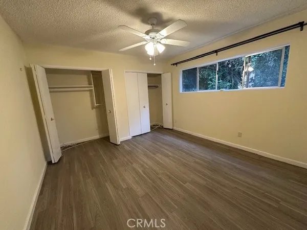 a front view of house with yard and trees