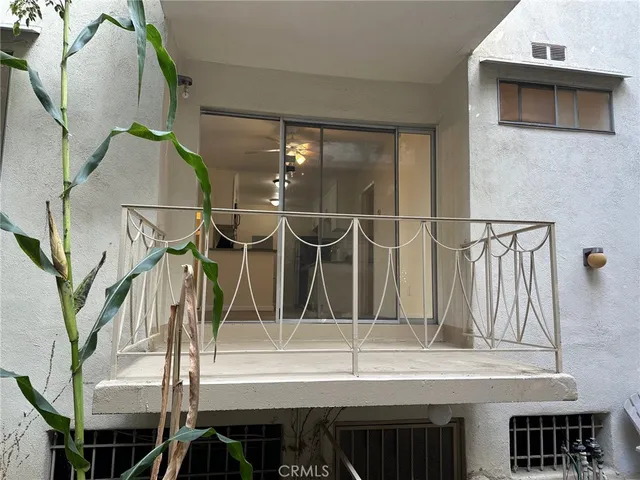 a bathroom with a granite countertop bathtub shower sink vanity and toilet