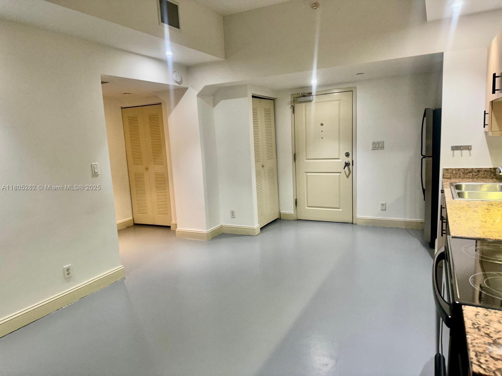 111 East Flagler Street, Unit 702 Miami, FL 33131 - Photo 3 of 11 a view of a storage & utility room