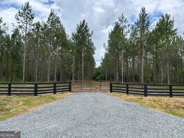 a view of outdoor space with deck and trees