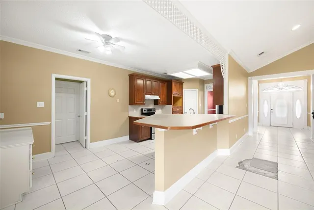 a kitchen with stainless steel appliances granite countertop a sink and dishwasher with white cabinets