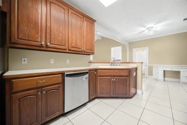 a kitchen with stainless steel appliances granite countertop a stove sink and cabinets