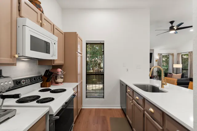 a kitchen with a stove and a microwave