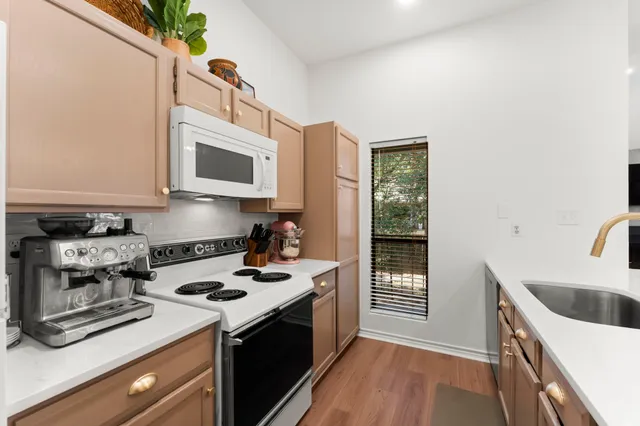 a kitchen with a stove and a microwave