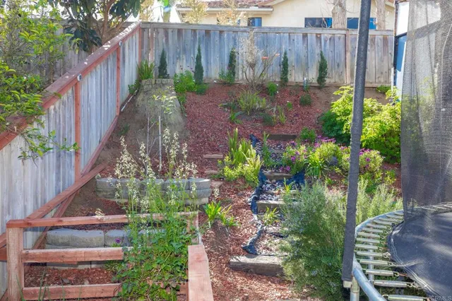 a view of a backyard with a garden