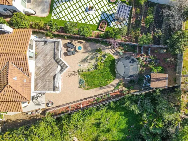 a backyard of a house with outdoor seating