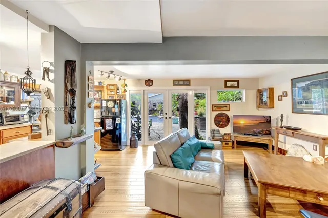 a view of an entryway with wooden floor