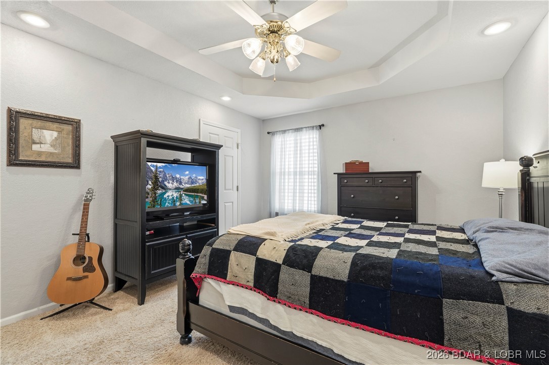 412 West Champain Street Eldon, MO 65026 - Photo 14 of 32 Primary suite offers ambient canned lighting, tray