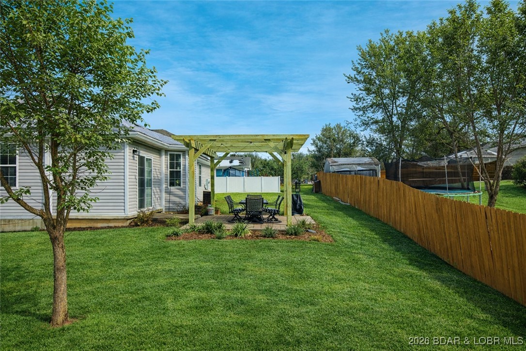 412 West Champain Street Eldon, MO 65026 - Photo 26 of 32 Enjoy warm weather BBQ's off your concrete patio w