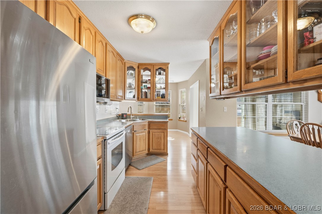 412 West Champain Street Eldon, MO 65026 - Photo 7 of 32 Decorative, glass door, upper cabinets allows for