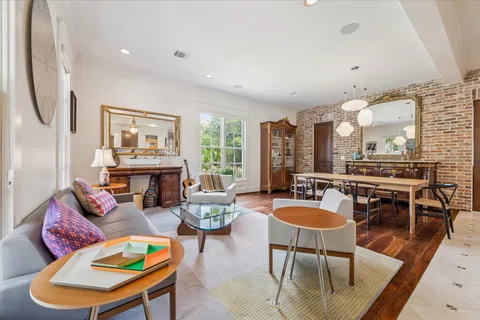 a living room with furniture fireplace and a flat screen tv