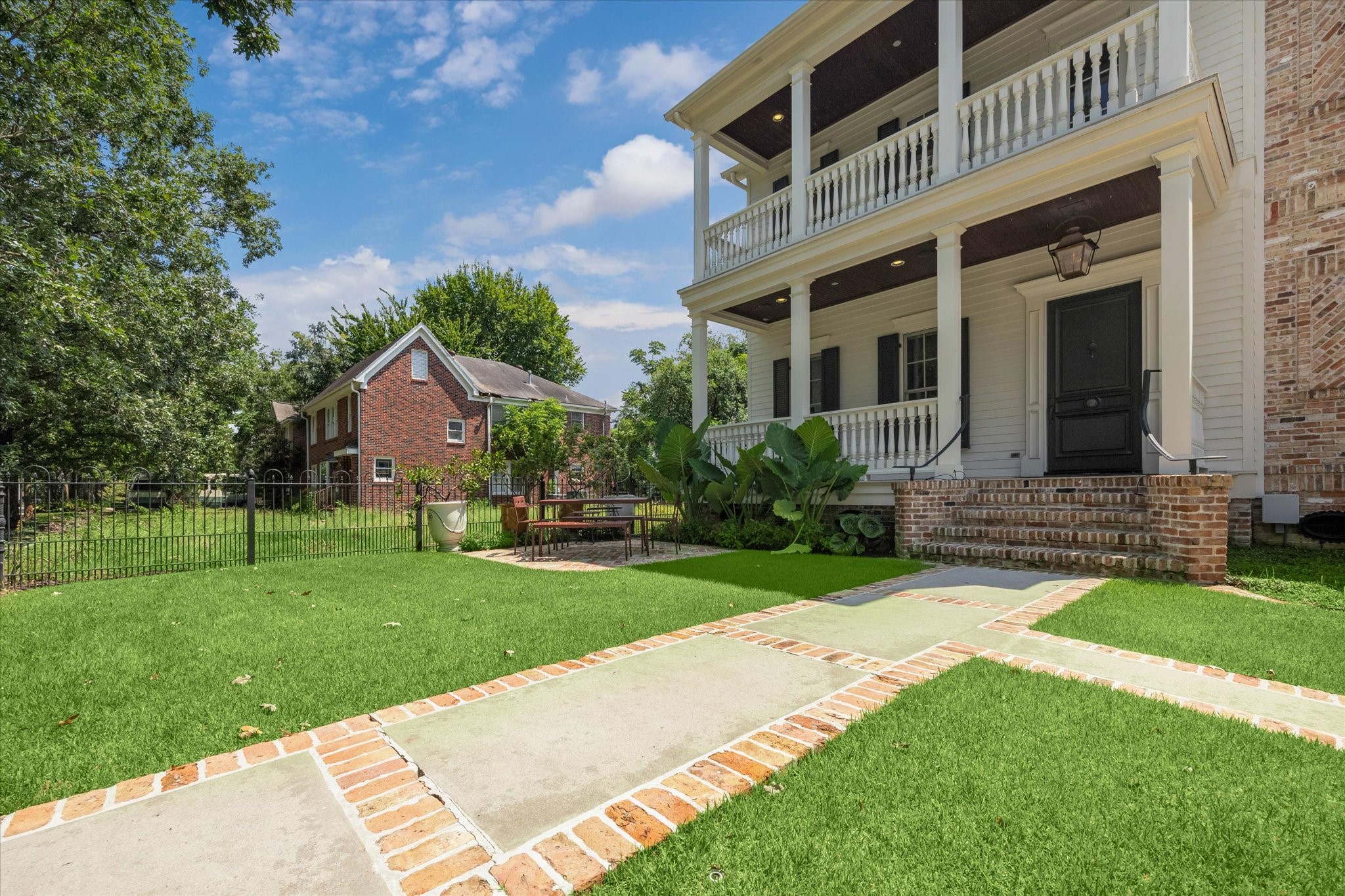 1819 Banks Street Houston, TX 77098 - Photo 2 of 43 a front view of a house with a yard