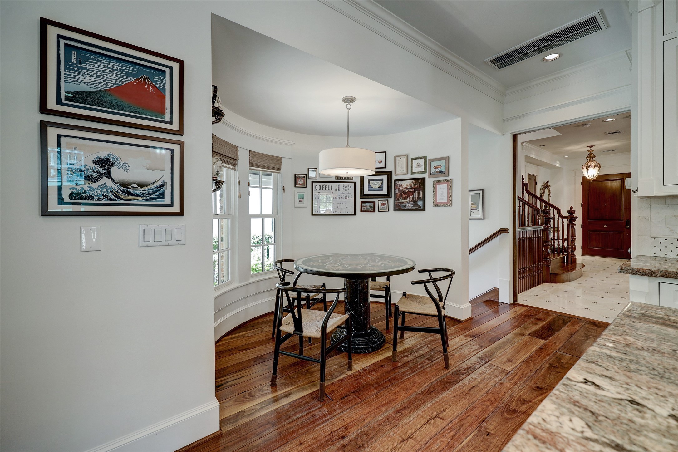 1819 Banks Street Houston, TX 77098 - Photo 22 of 43 a view of a dining room with furniture and wooden floor