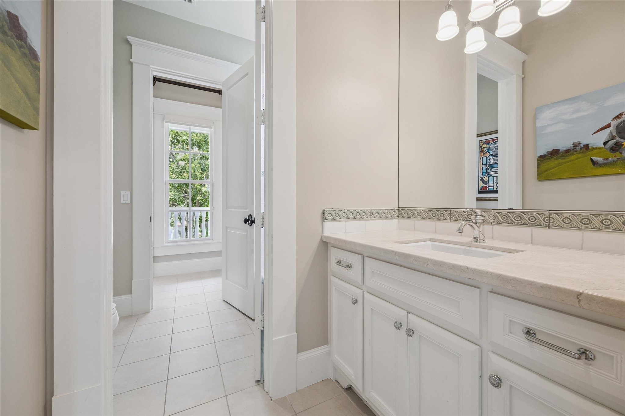1819 Banks Street Houston, TX 77098 - Photo 27 of 43 a bathroom with a sink and a mirror