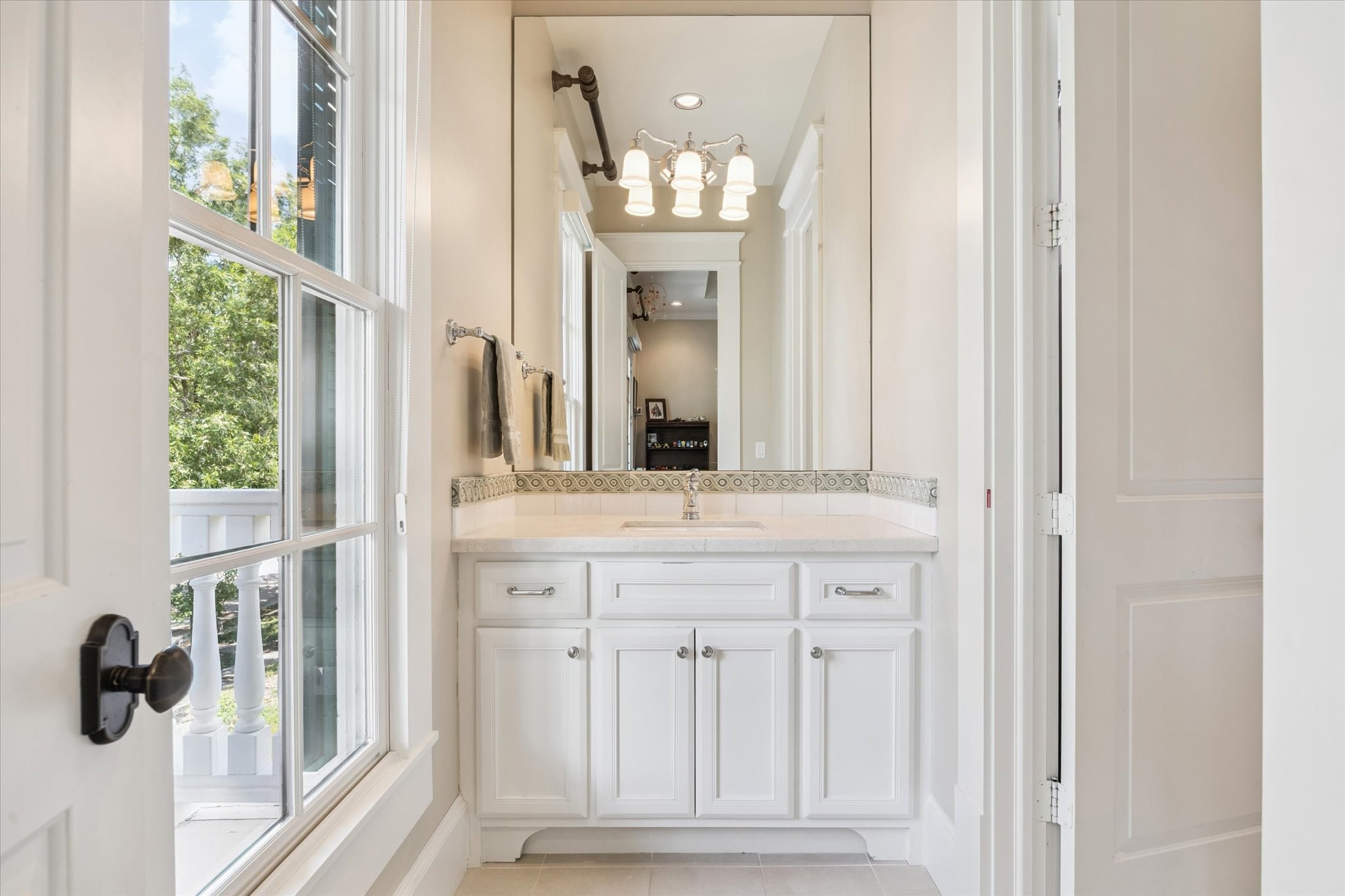 1819 Banks Street Houston, TX 77098 - Photo 28 of 43 a bathroom with a sink and a mirror