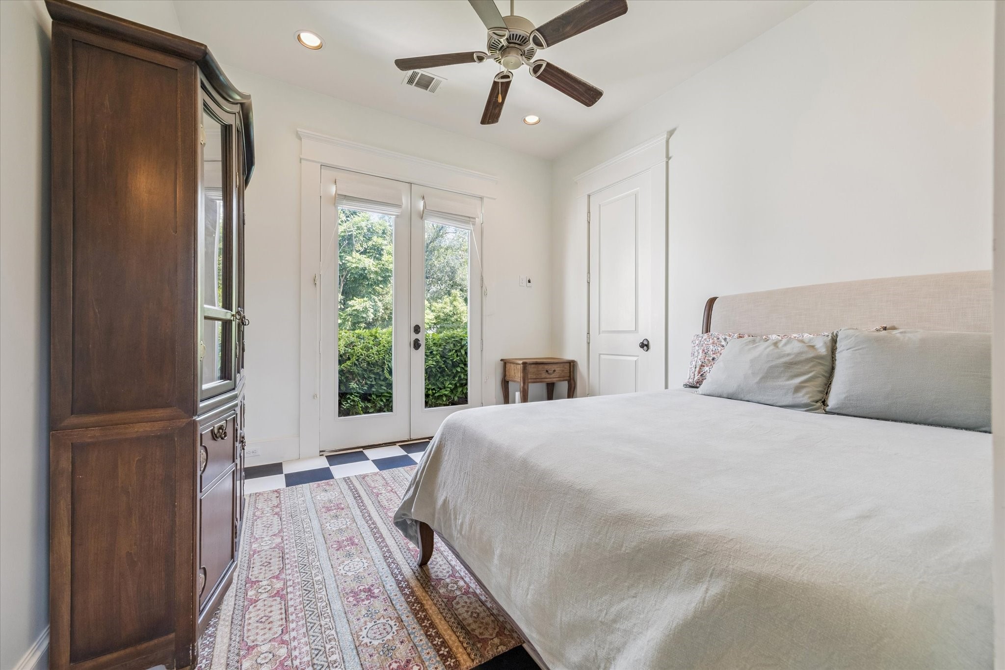 1819 Banks Street Houston, TX 77098 - Photo 35 of 43 a bedroom with a large bed and a window